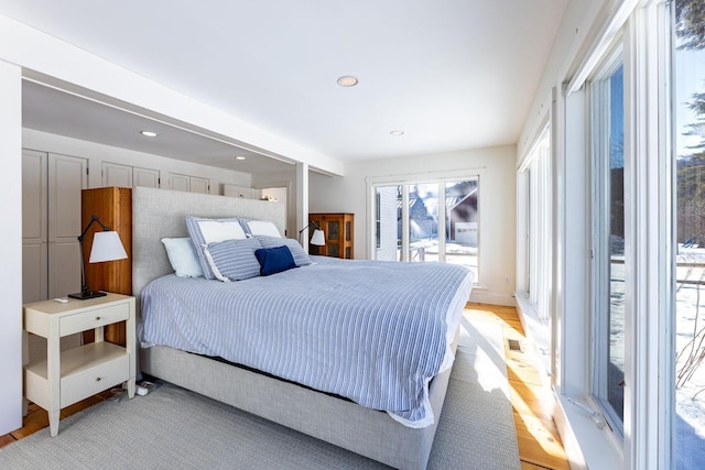 bedroom featuring recessed lighting and access to exterior