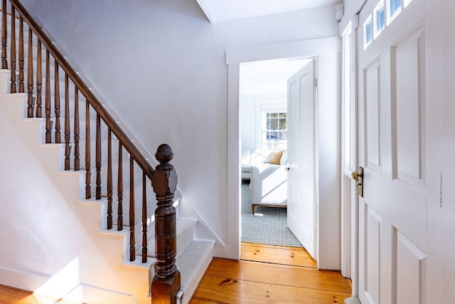 stairway with wood finished floors