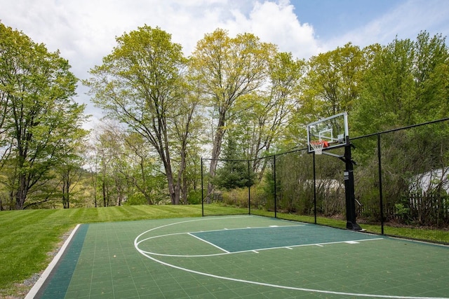 view of basketball court with a yard and community basketball court