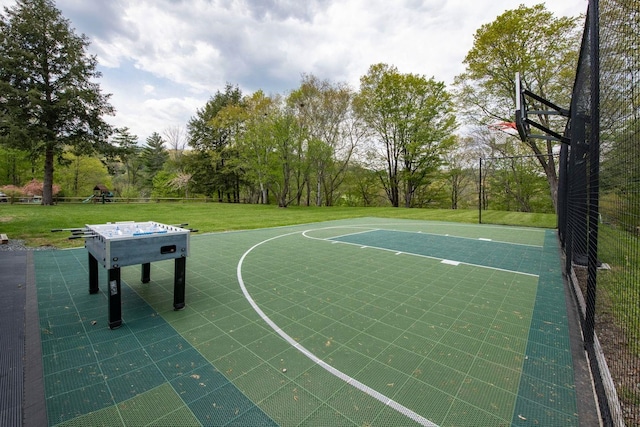 view of sport court featuring community basketball court and a lawn