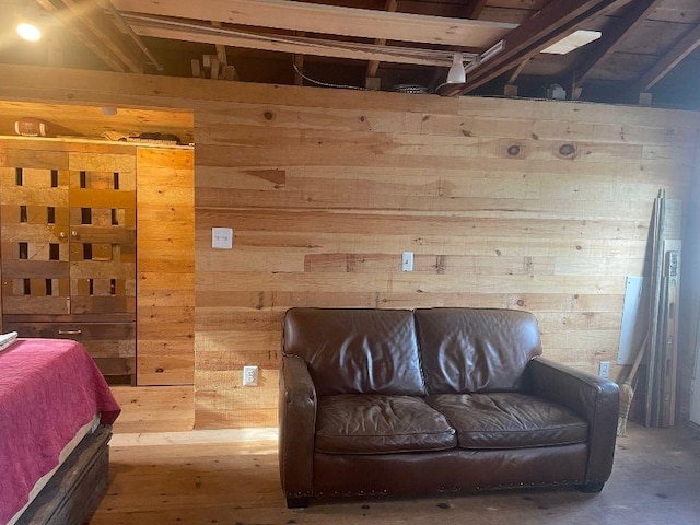 bedroom featuring wooden walls