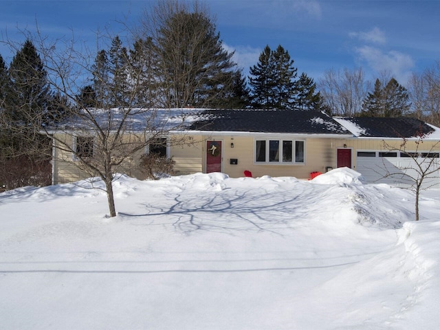 ranch-style home featuring a garage