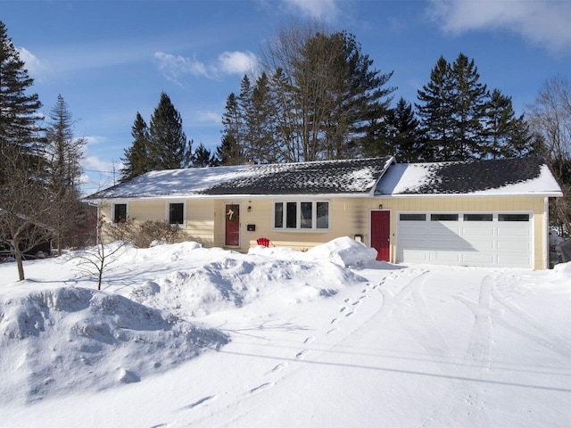 ranch-style home featuring a garage