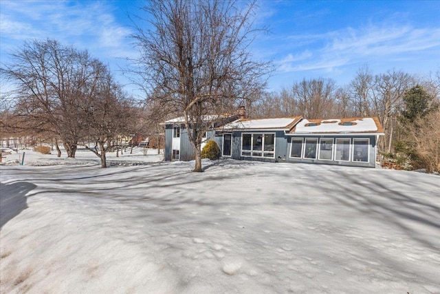 view of front of house with a sunroom