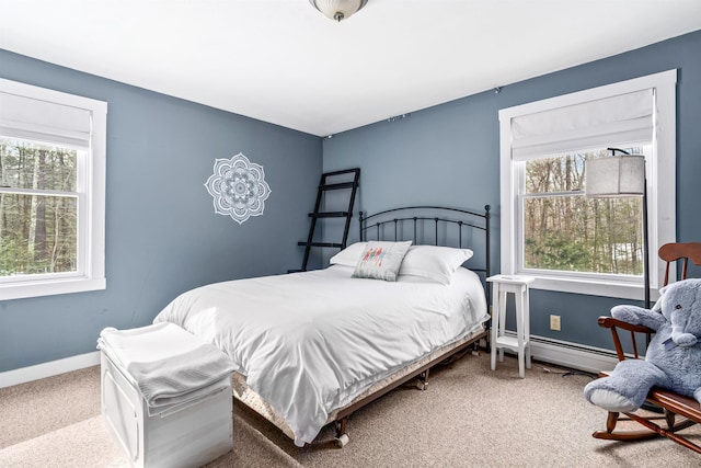 bedroom with carpet floors, a baseboard radiator, and baseboards