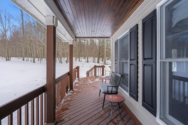 view of snow covered deck