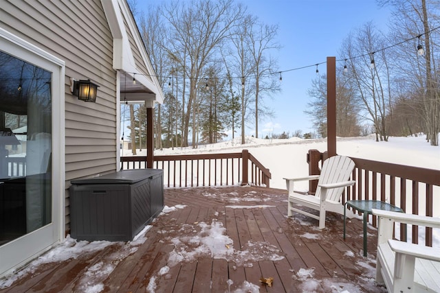 view of snow covered deck