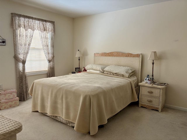 bedroom featuring baseboards and carpet floors