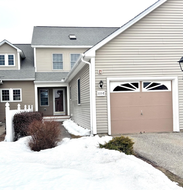 view of front of home with a shingled roof