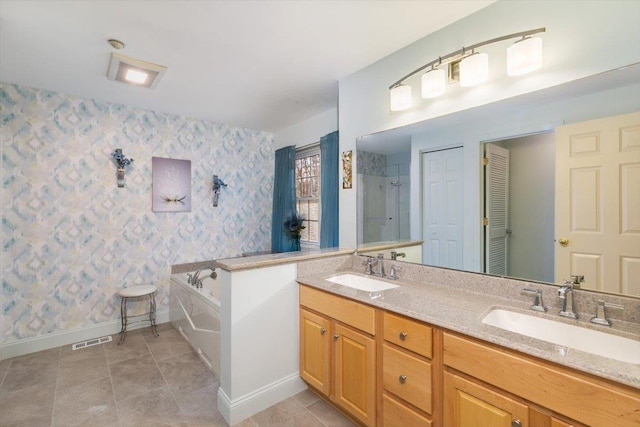 full bathroom featuring tile patterned floors, visible vents, wallpapered walls, and a sink