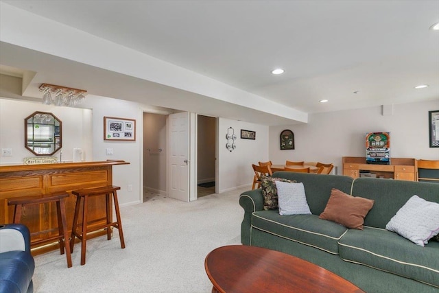 living room featuring recessed lighting, baseboards, and light colored carpet