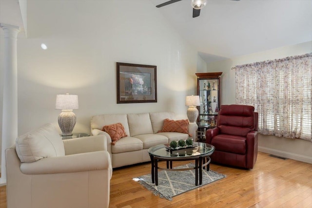 living room with a ceiling fan, visible vents, ornate columns, high vaulted ceiling, and light wood-style flooring