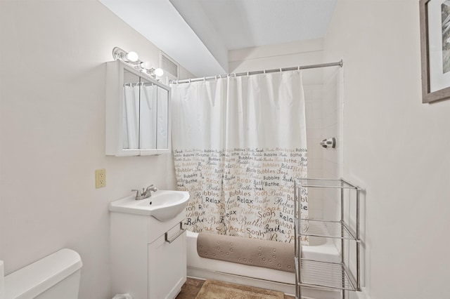 full bath featuring vanity, shower / tub combo, and toilet