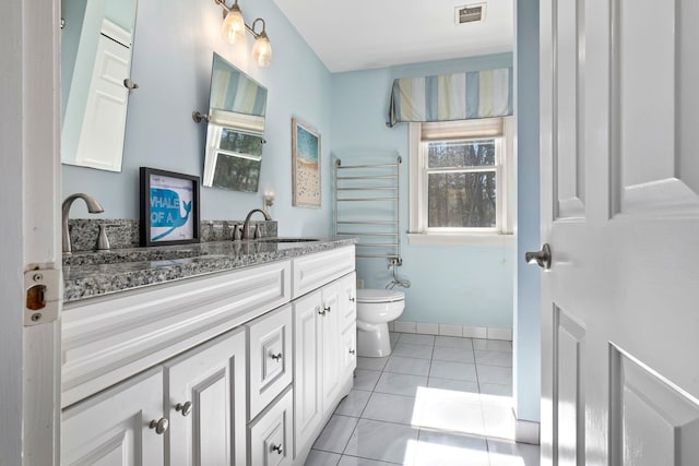 bathroom with tile patterned floors, visible vents, toilet, and vanity