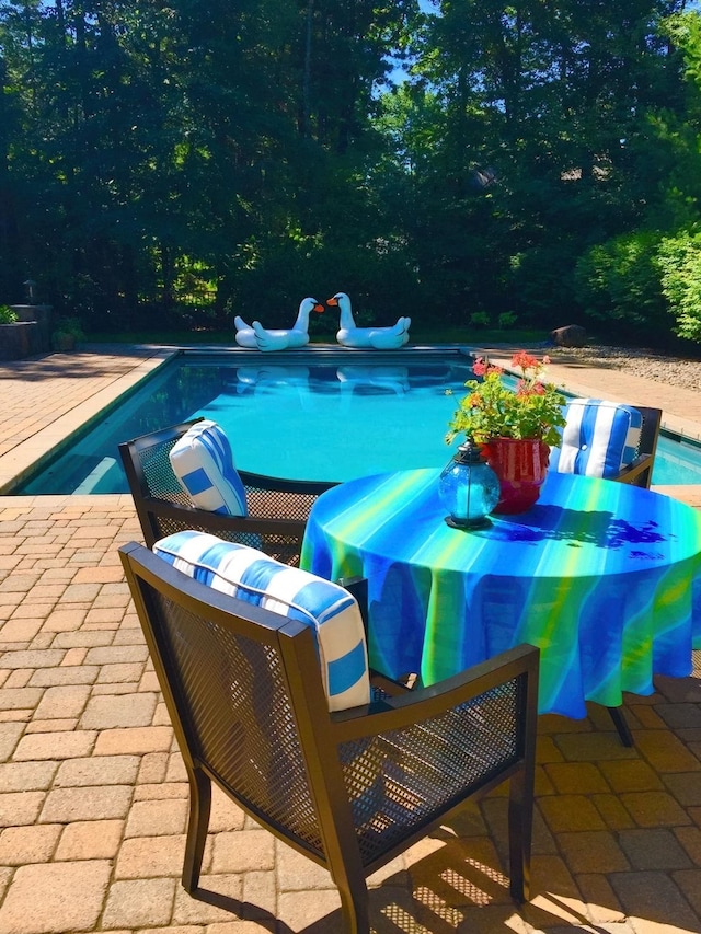 outdoor pool featuring a patio