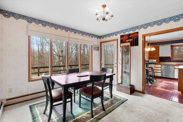 dining space featuring baseboards, an inviting chandelier, and wallpapered walls