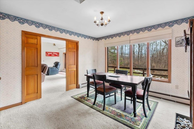 dining room featuring a baseboard radiator, light colored carpet, a notable chandelier, and wallpapered walls