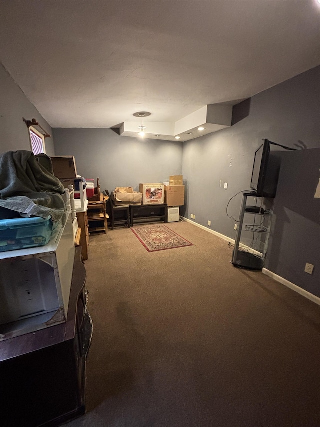 living area with baseboards and carpet flooring