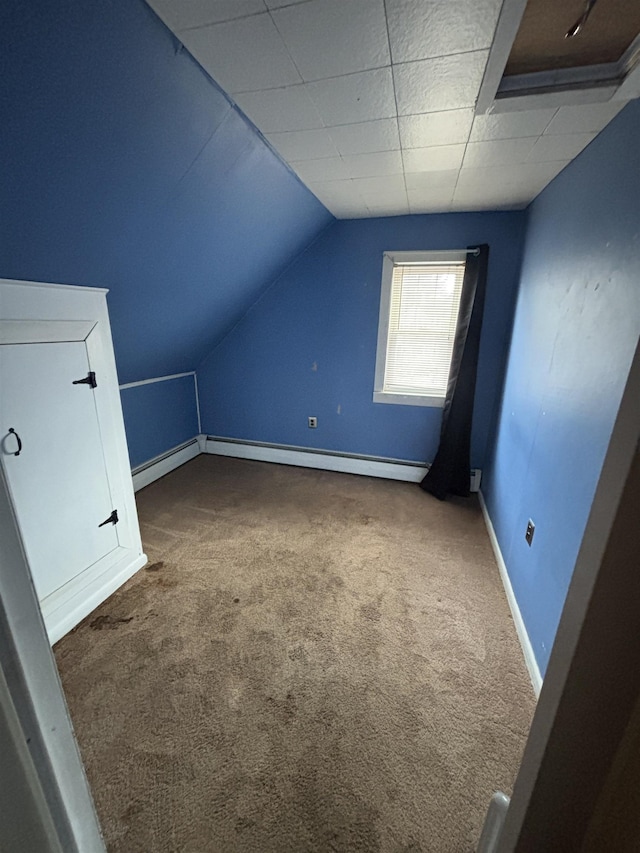 bonus room with baseboards, carpet flooring, baseboard heating, and lofted ceiling