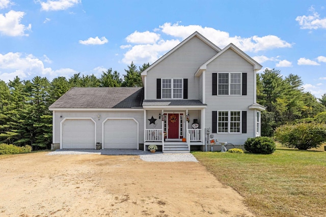 traditional-style house with a garage, a front yard, covered porch, and driveway