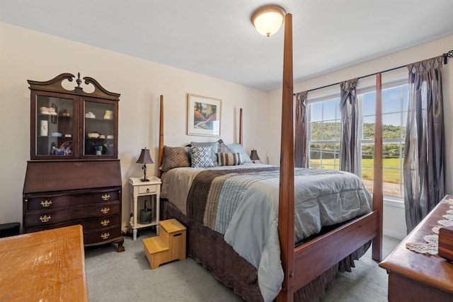 bedroom with light colored carpet