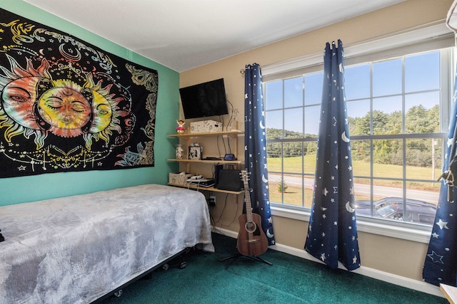 carpeted bedroom with baseboards