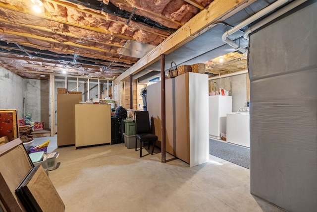 unfinished basement with washer / dryer