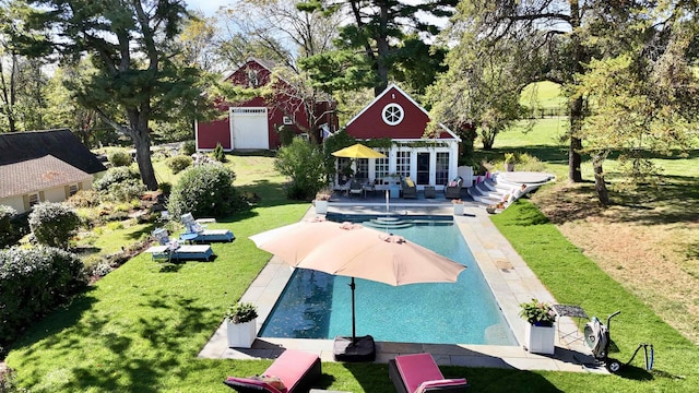 pool with an exterior structure, a wooden deck, a lawn, an outdoor structure, and a patio area