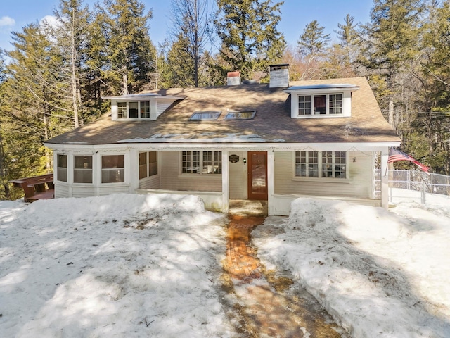 view of front of home with a chimney