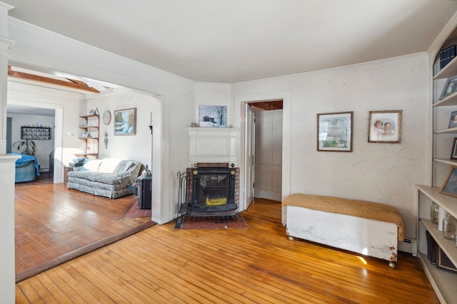 unfurnished bedroom with hardwood / wood-style floors and a wood stove