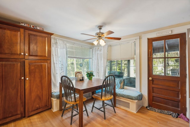 dining space featuring light wood-style floors and a ceiling fan