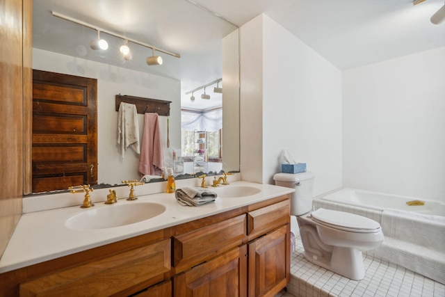 bathroom with tile patterned flooring, double vanity, toilet, and a sink