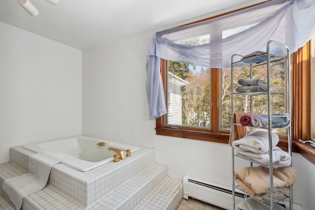 bathroom featuring a garden tub and baseboard heating