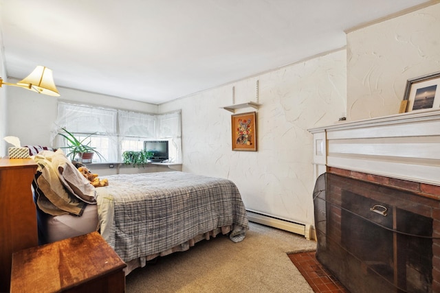 bedroom with a baseboard radiator, carpet floors, and a textured wall