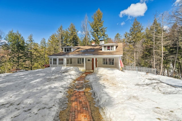 view of front of house featuring a chimney