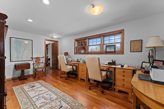 office featuring recessed lighting, baseboards, and light wood-style floors