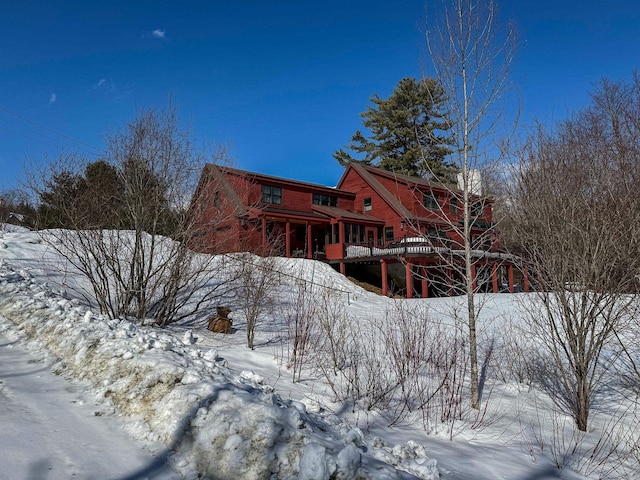 view of snow covered house