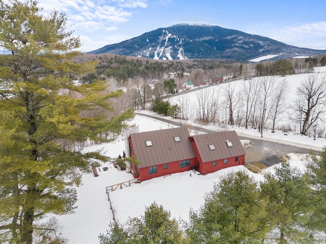 snowy aerial view featuring a mountain view