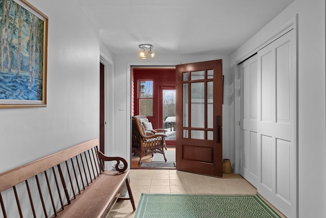 doorway to outside featuring tile patterned floors