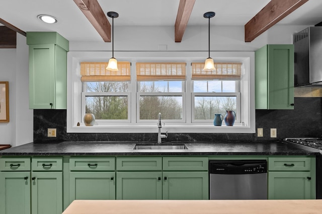 kitchen with green cabinets, appliances with stainless steel finishes, and a sink