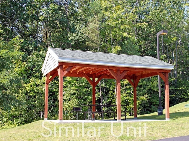 view of property's community with a gazebo and a yard