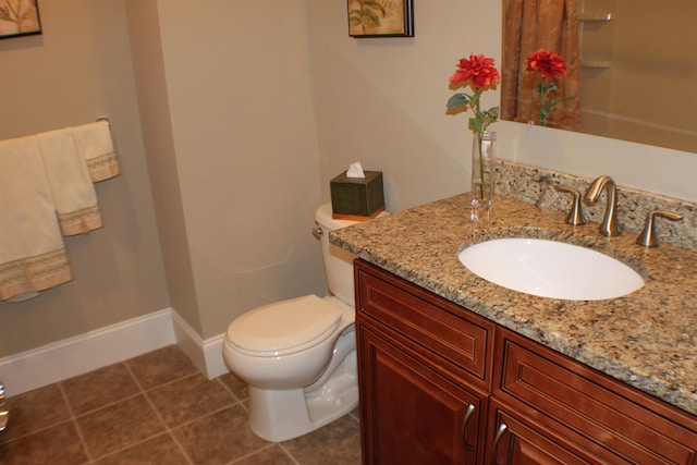 full bathroom featuring vanity, tile patterned floors, toilet, and baseboards