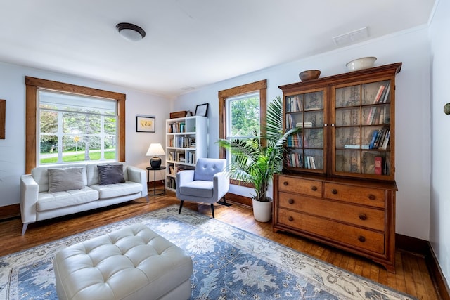 sitting room with visible vents, baseboards, and hardwood / wood-style flooring