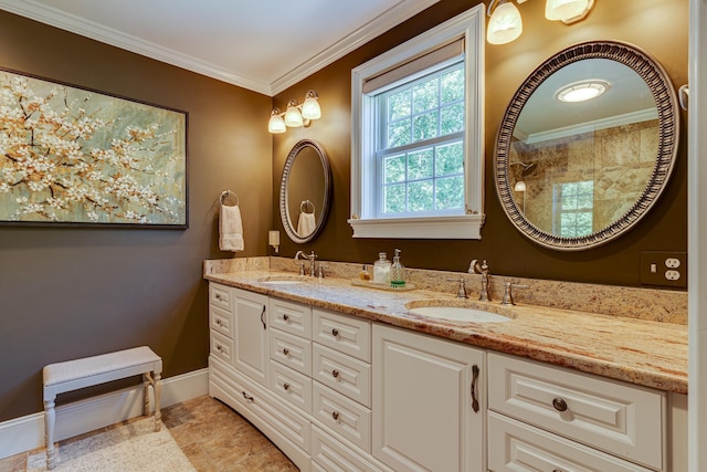 bathroom featuring a sink, baseboards, ornamental molding, and double vanity