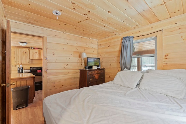 bedroom featuring wood finished floors, wooden ceiling, and wood walls