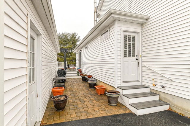 property entrance with a patio