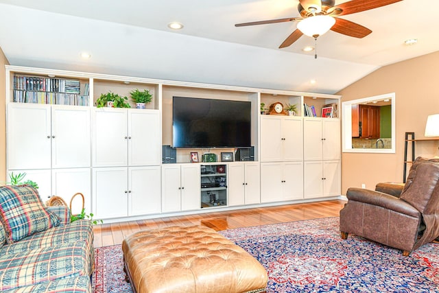 living room with recessed lighting, light wood-style flooring, a ceiling fan, and lofted ceiling