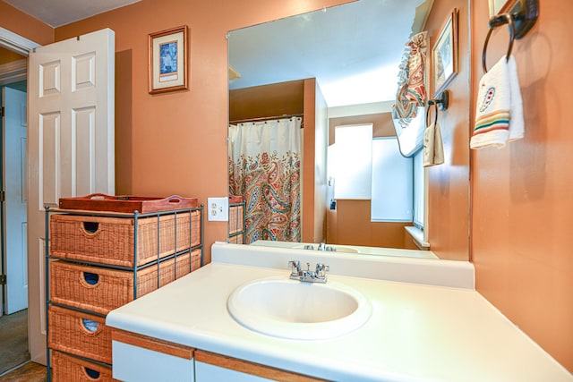 bathroom with vanity and a shower with curtain