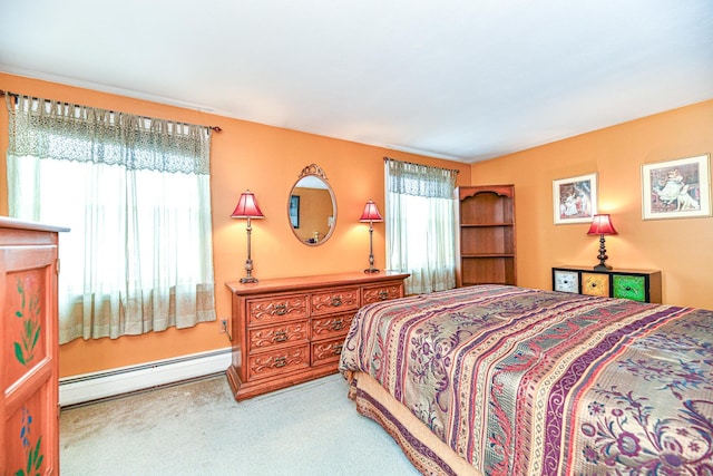 bedroom with carpet and baseboard heating