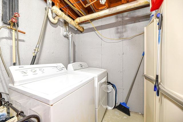 clothes washing area with laundry area and washer and clothes dryer